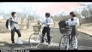 Two Asian girls are fucking on the bicycle in a public place