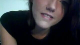 A pretty young girl caresses herself and shows it on the webcam